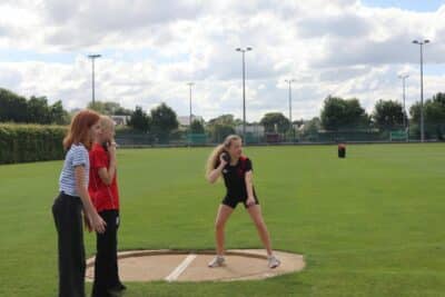 Lower School pupil taking part in shotput