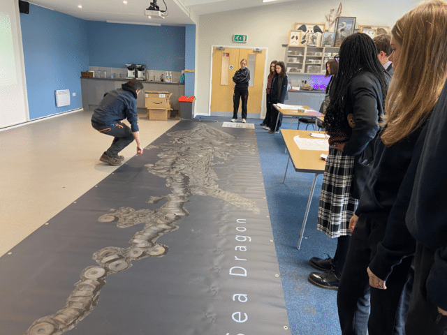 Conservation Pupils looking at Sea Dragon poster