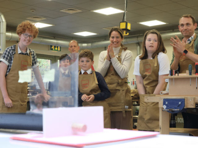 Children and parents take part in a STEM challenge