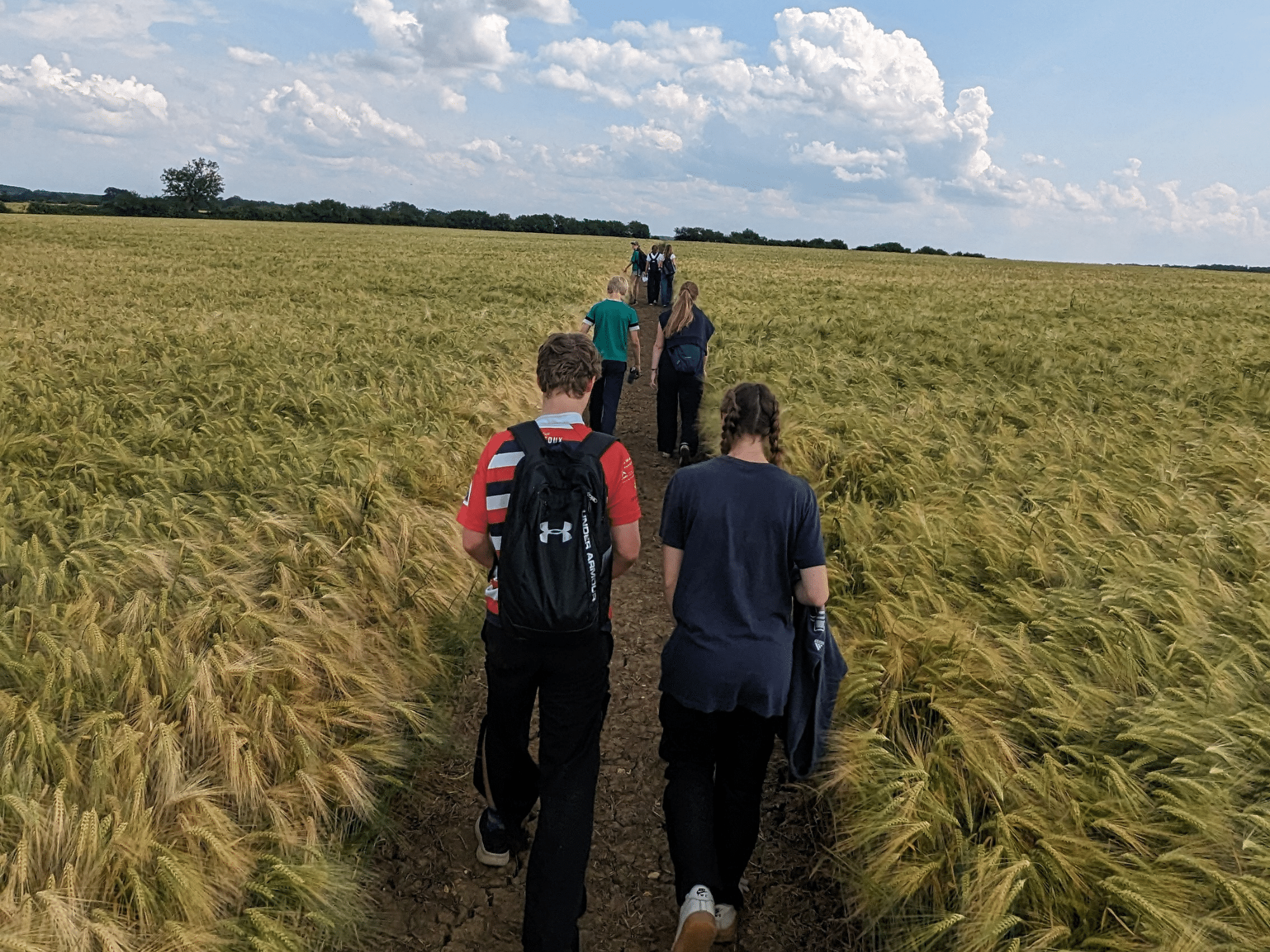 Pupils walking across fields